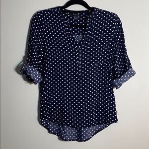 Navy blue and white polka dot blouse